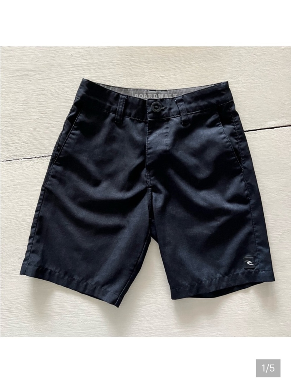 Rip Curl Black Flat Front Shorts boys size 22 with button pocket on back